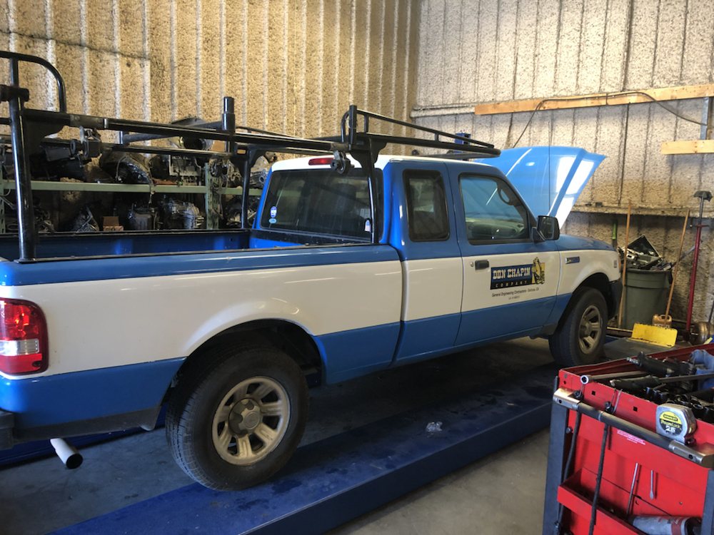 A Ford Ranger pickup up on the lift